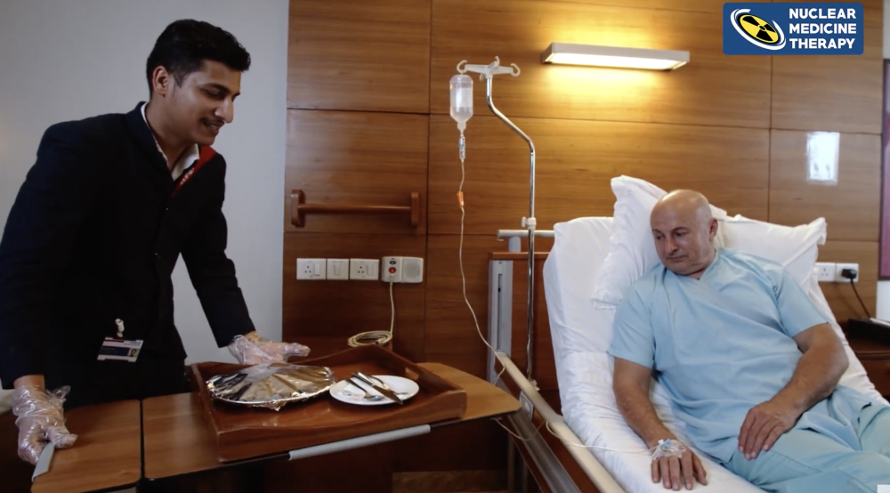 Patient receiving care in a day-care therapy room at FMRI, Gurugram