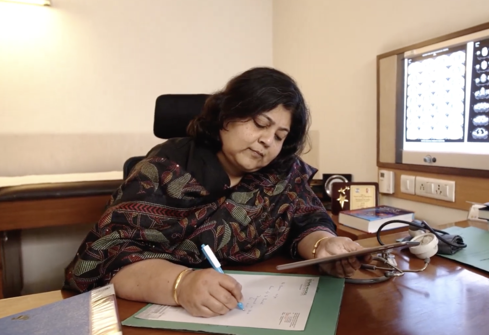 Nuclear medicine physician working in a consultation room at FMRI, Gurugram